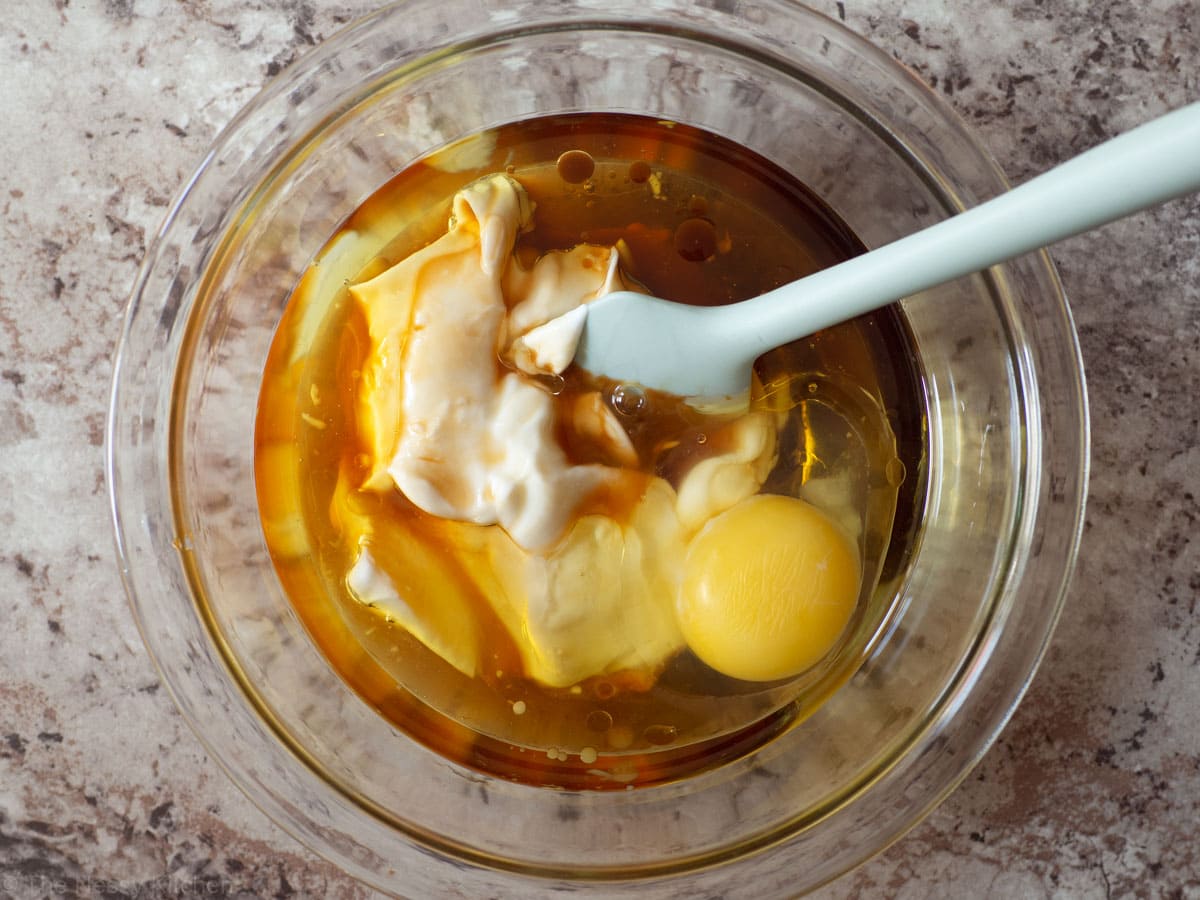 Wet ingredients in a glass mixing bowl.