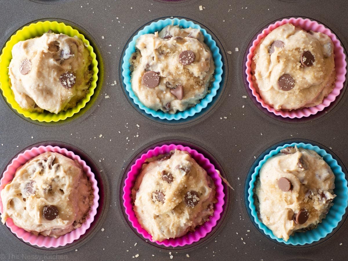 Muffin batter divided out into tins.