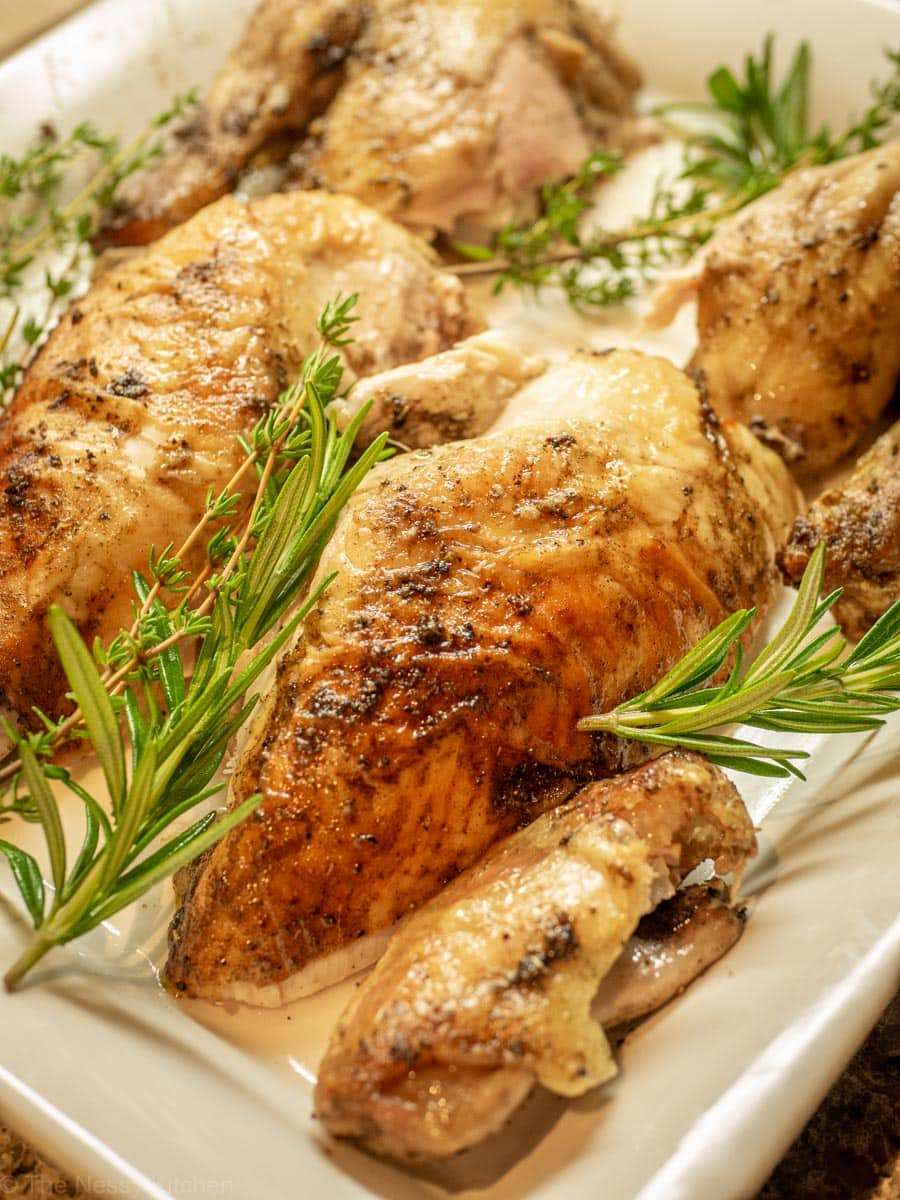 Serving plate with carved chicken.