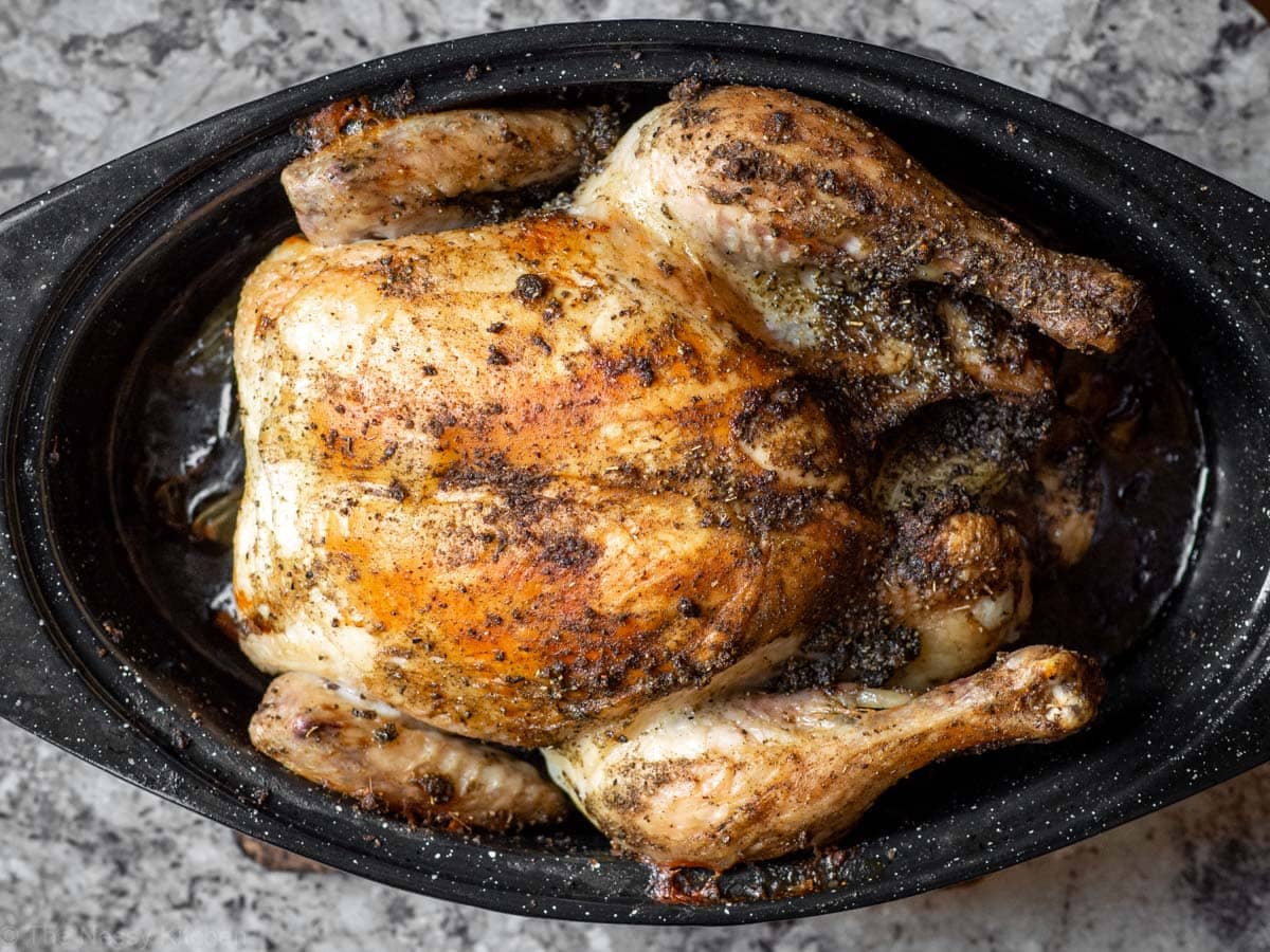 Roasted chicken in a roaster.