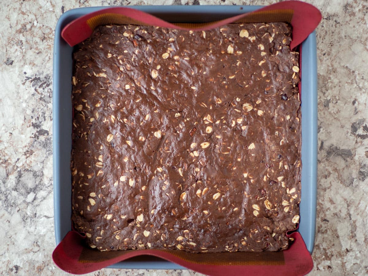 Mixture pressed down into an even layer in the baking pan.