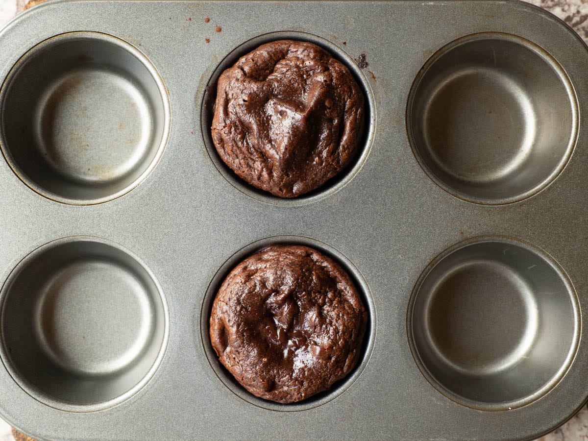 Baked lava cakes in a muffin tin.