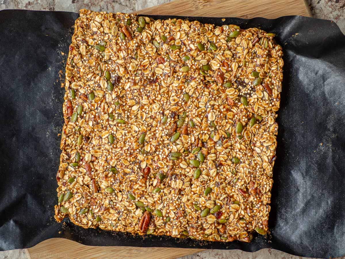 Granola bars on a cutting board before slicing.