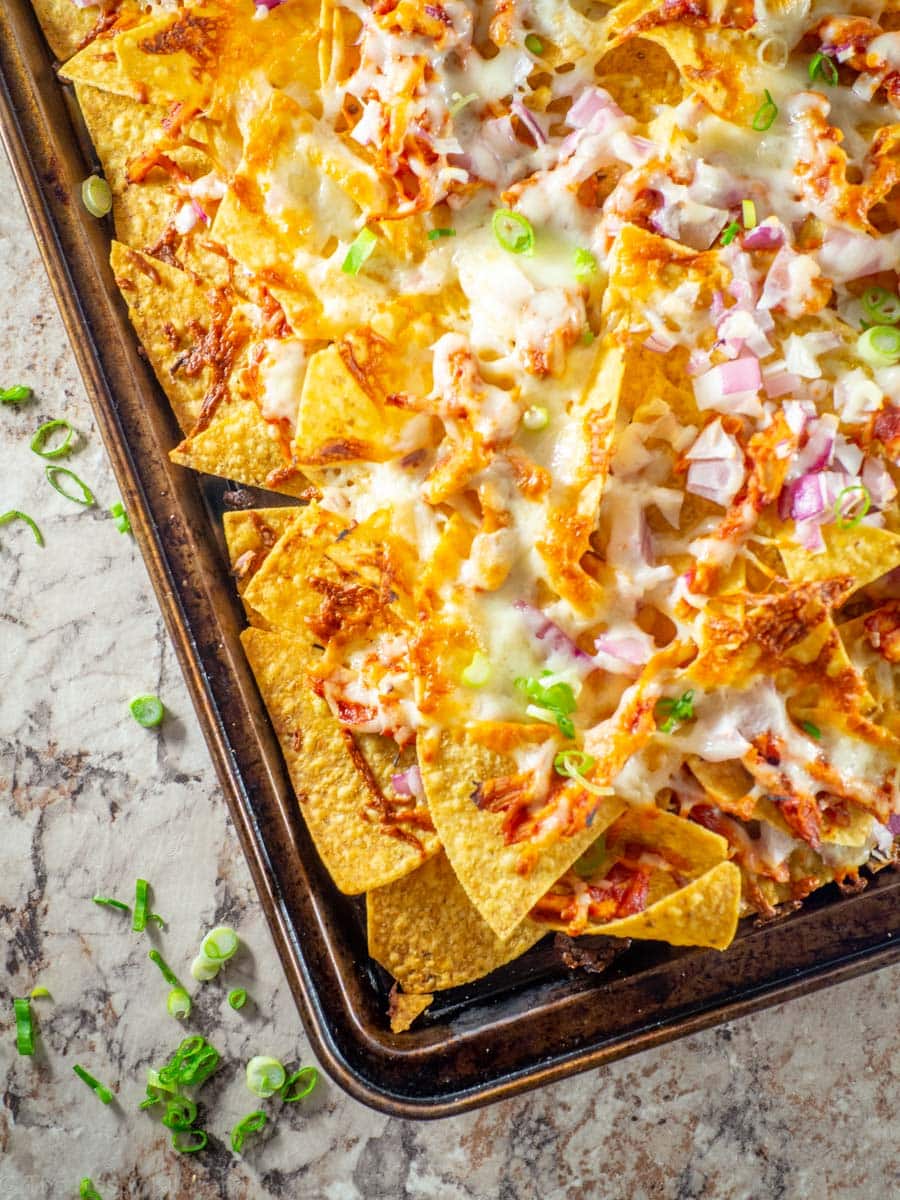 Tray of baked barbecue chicken nachos.