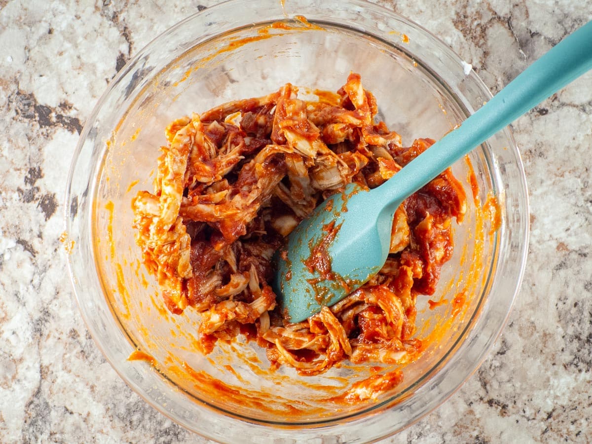Barbecue sauce mixed with shredded chicken.