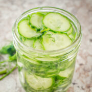 English cucumber pickles in a mason jar.