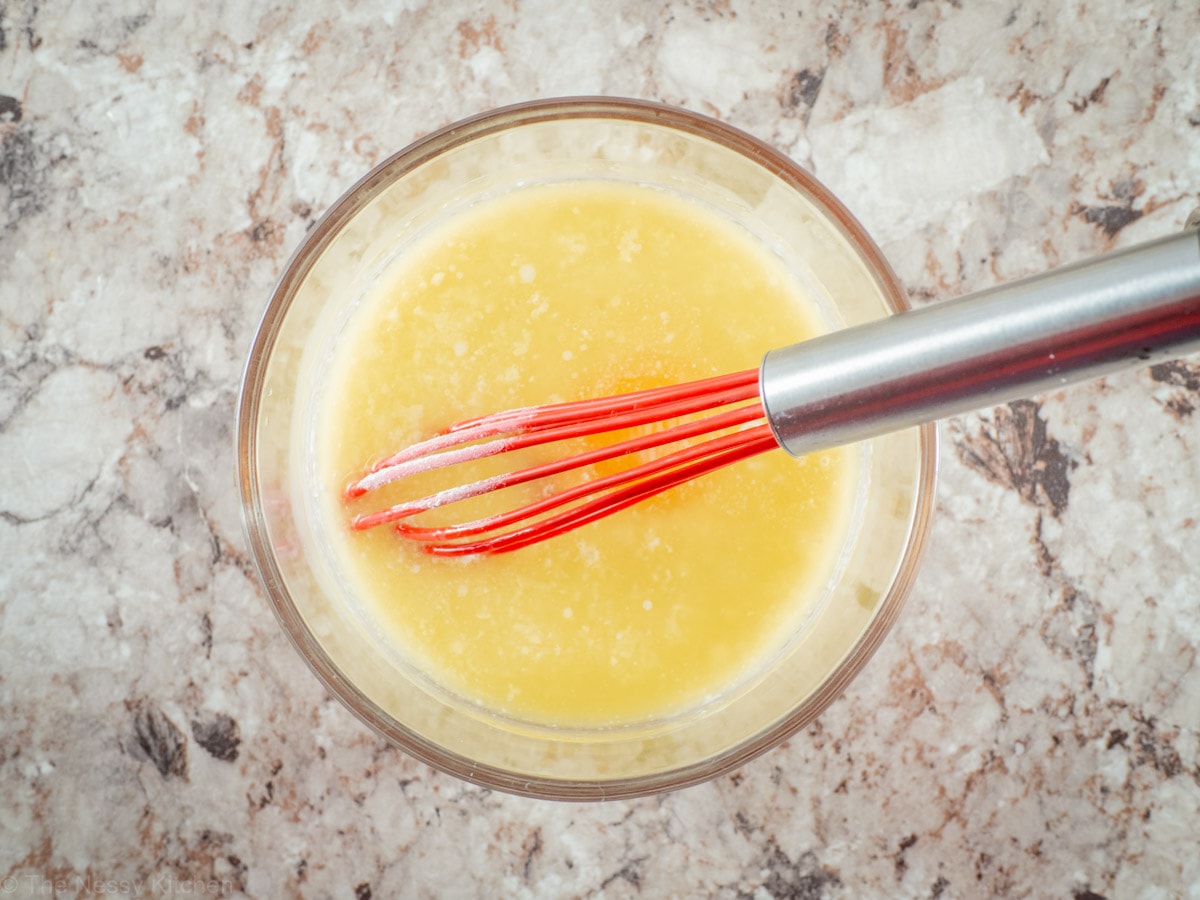 Wet ingredients whisked together in a bowl.