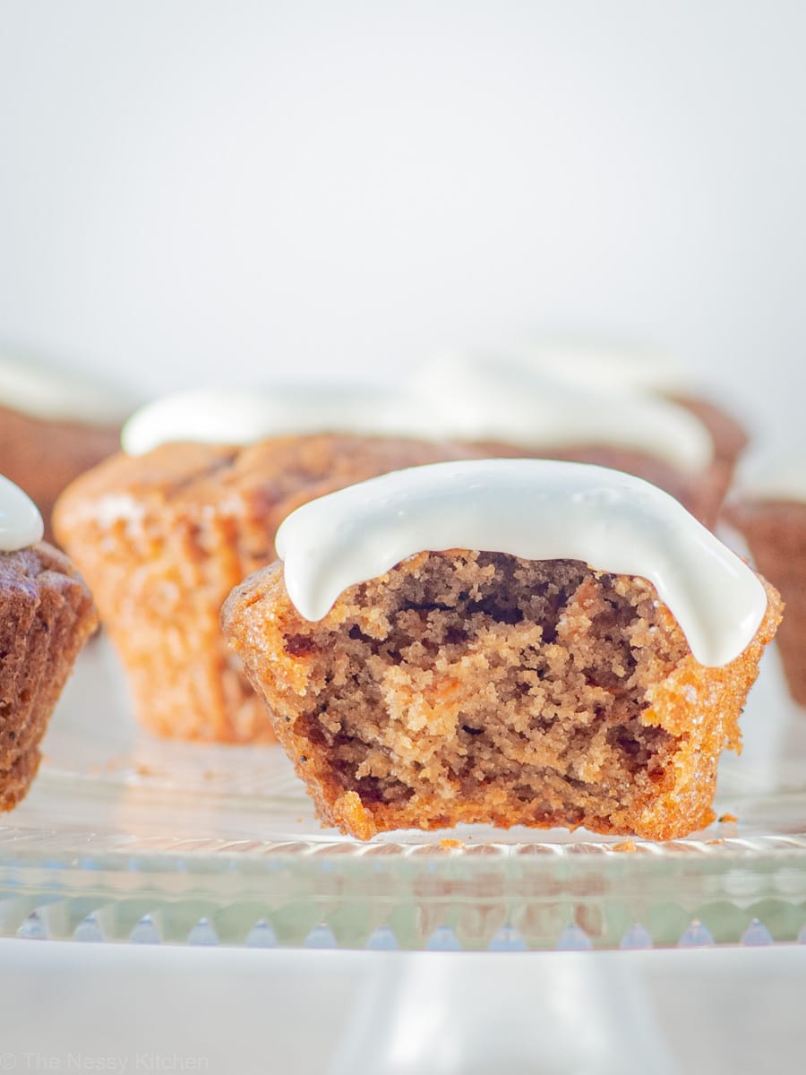 Frosted cupcake with a bite taken out.