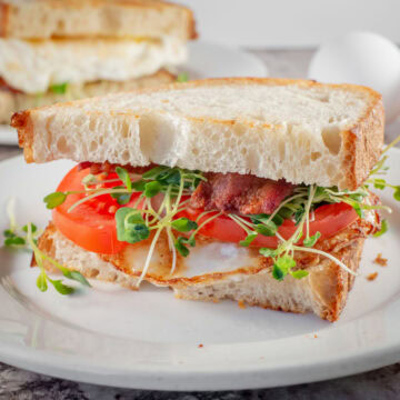 Sourdough sandwich with egg, bacon and tomato.