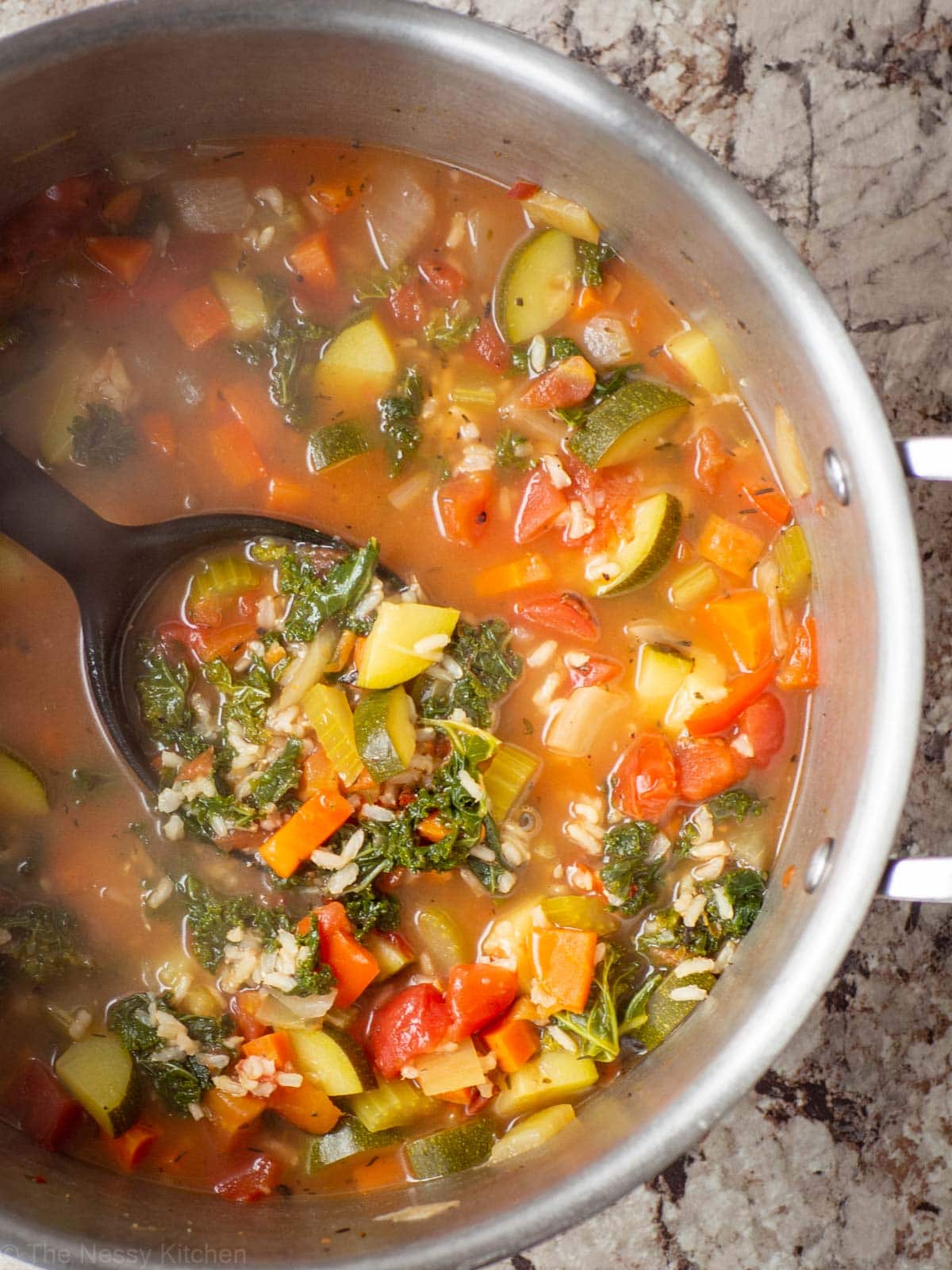Soup in a pot with a ladle.