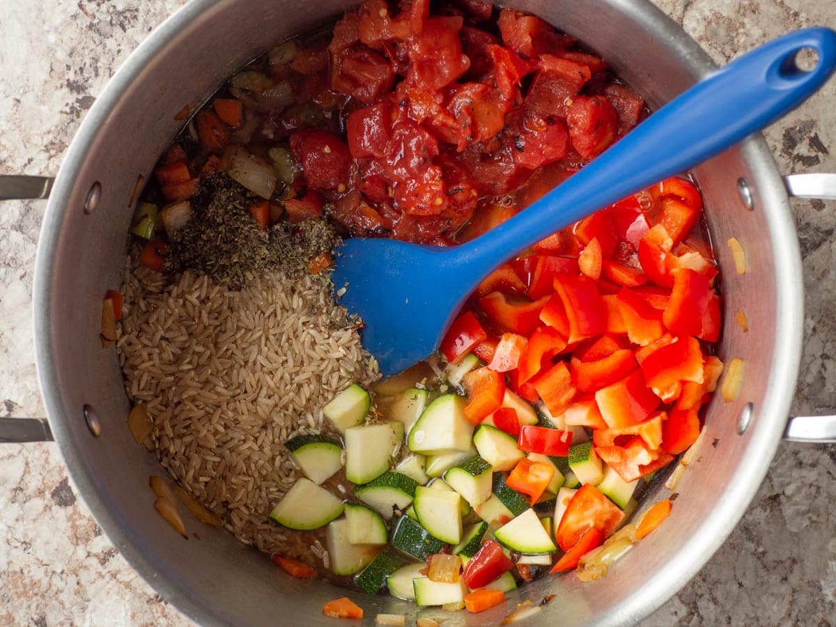 Remaining vegetables and rice added to the pot.