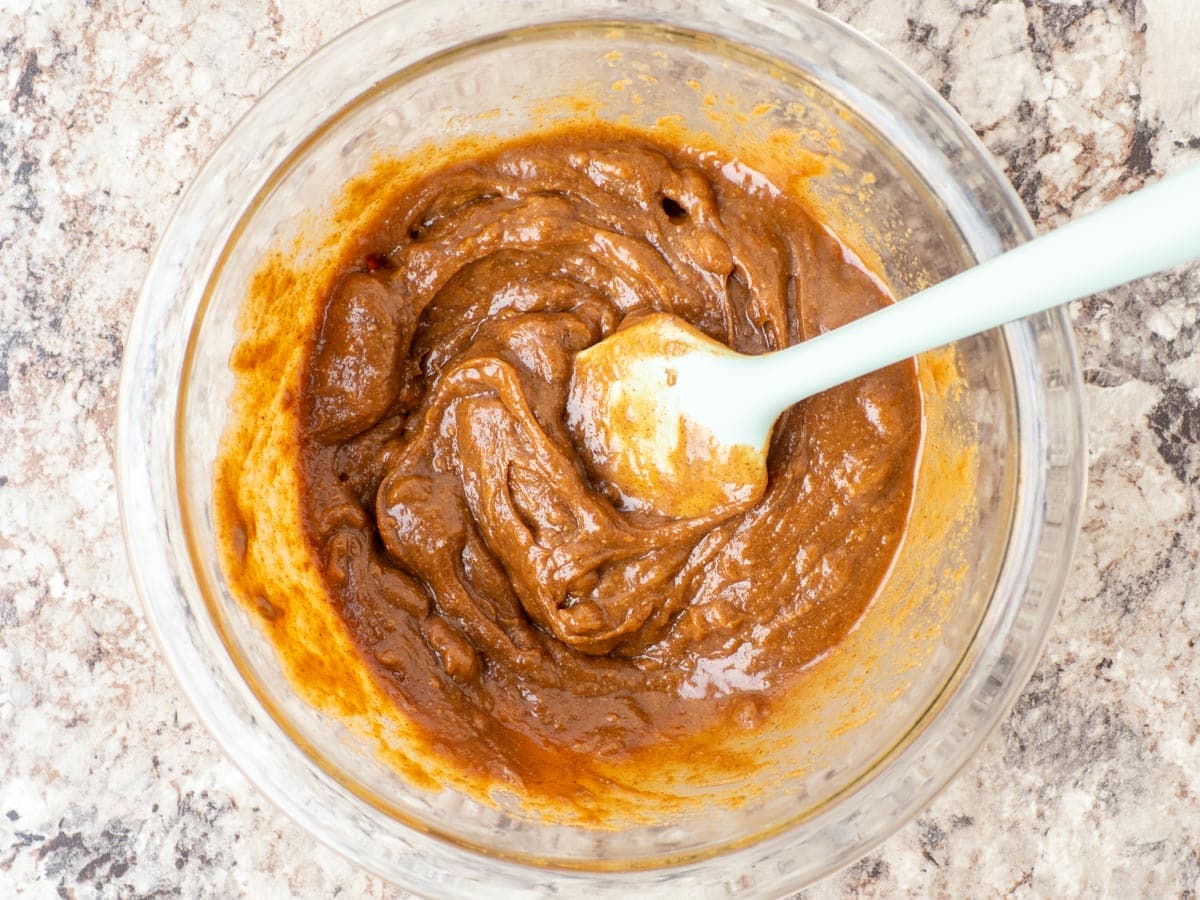 Almond butter and maple syrup combined in a bowl.