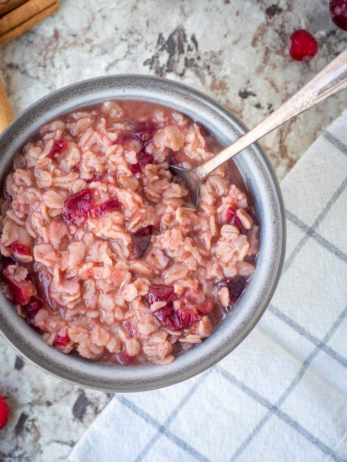 Oatmeal in a bowl with a spoon.