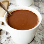 Creamy hot chocolate in a mug.