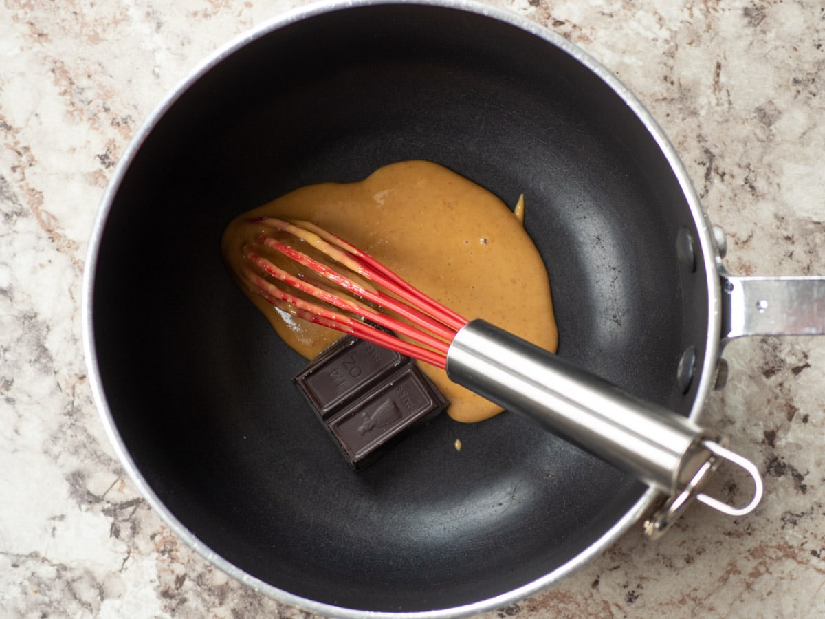 Nut butter and baking chocolate in a saucepan.