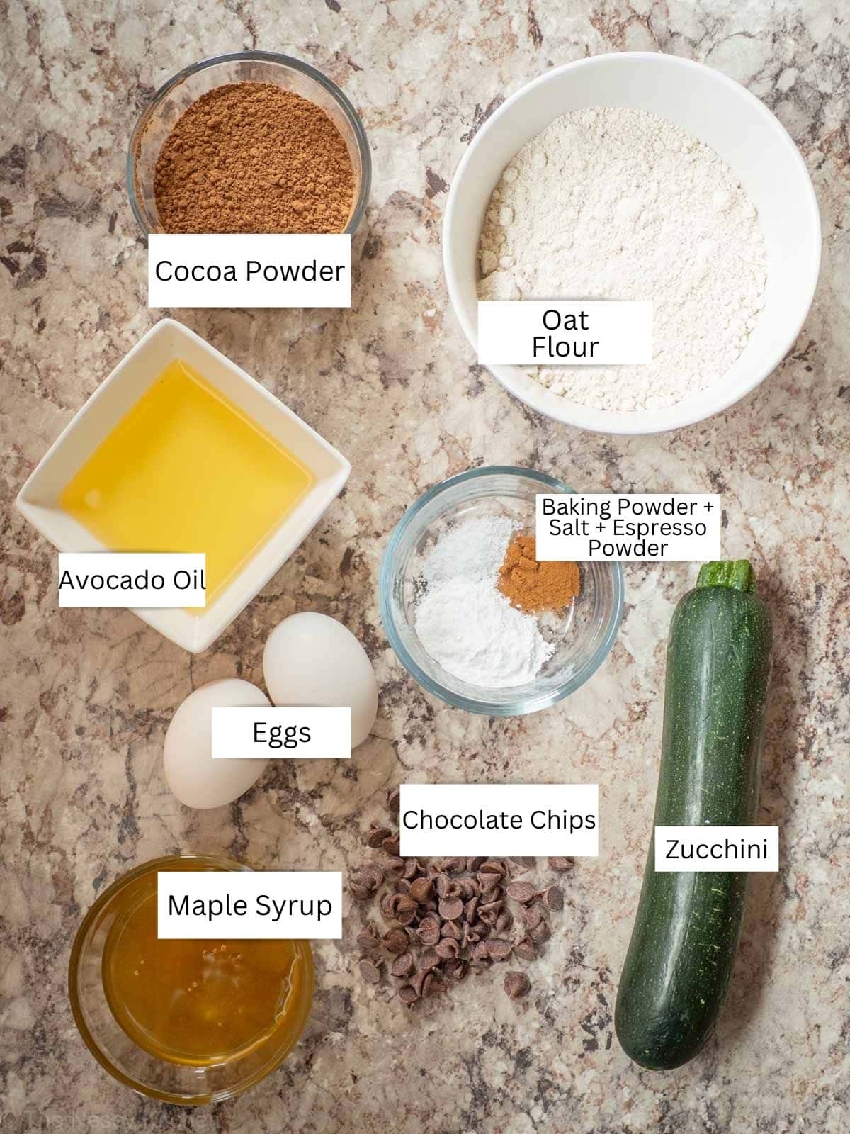 Ingredients for chocolate zucchini bread or muffins with oat flour.