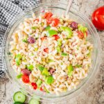 Greek chicken pasta salad in a large bowl.