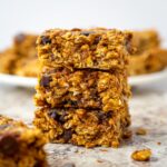 Pumpkin oatmeal bars stacked on one another.