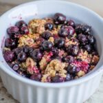 Saskatoon berry crisp in a bowl.