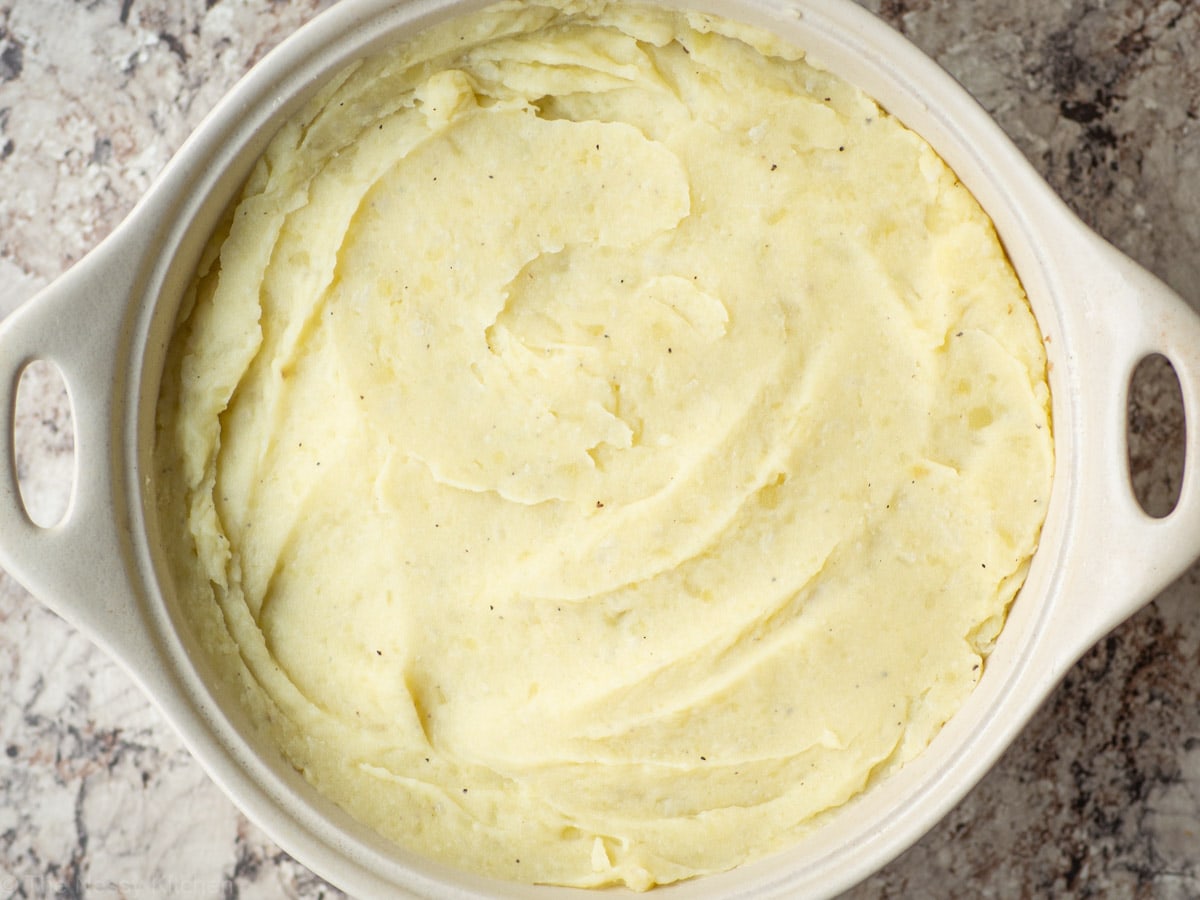 Mashed potato mixture over meat filling.