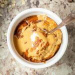 Air fryer baked oats topped with nut butter.