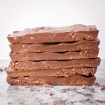 Chocolate protein bars in a stack.