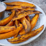 Sweet potato wedges on a plate.