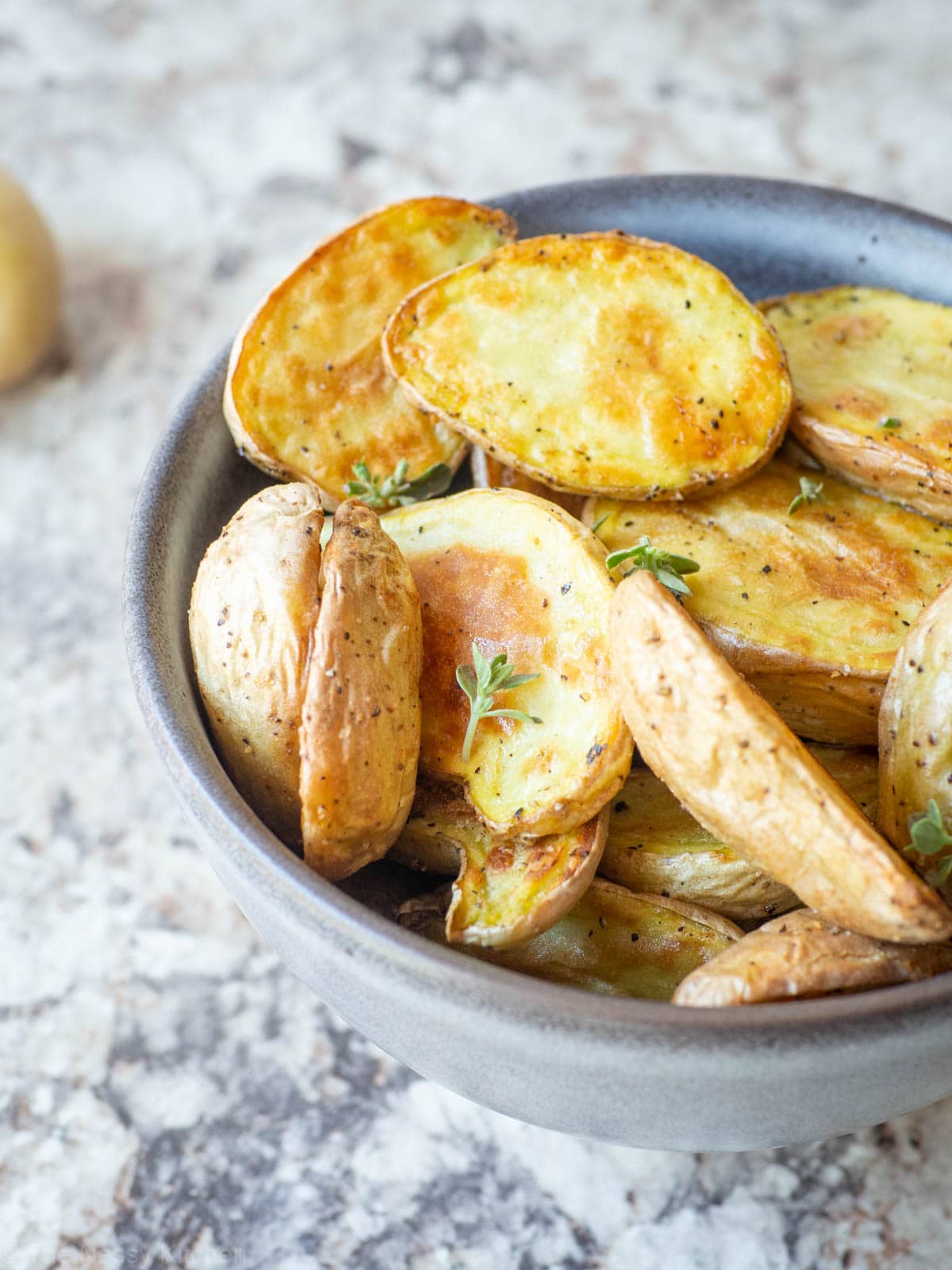 Crispy fingerling potatoes in a bowl.