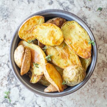 Serving bowl filled with fingerling potatoes.