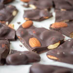 Chocolate almond bark on a plate.