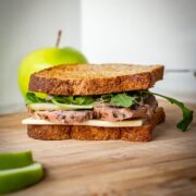 Sandwich on a cutting board.
