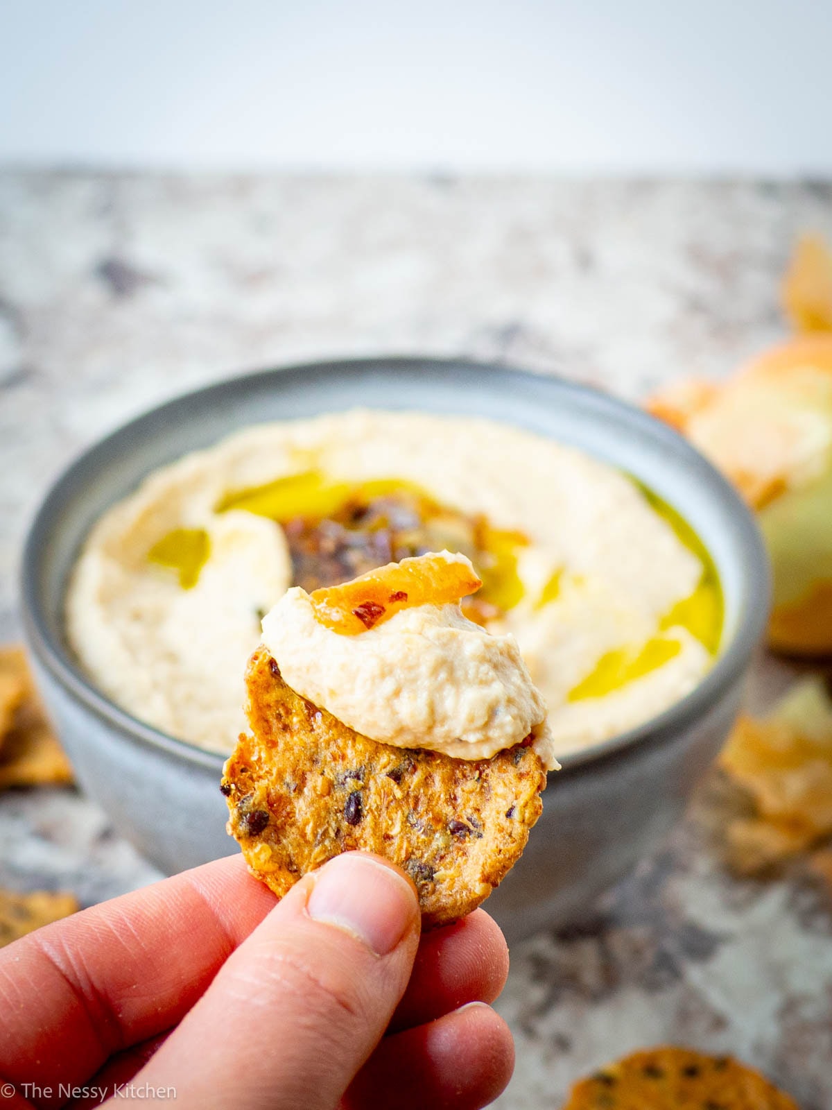 Hummus on a cracker.