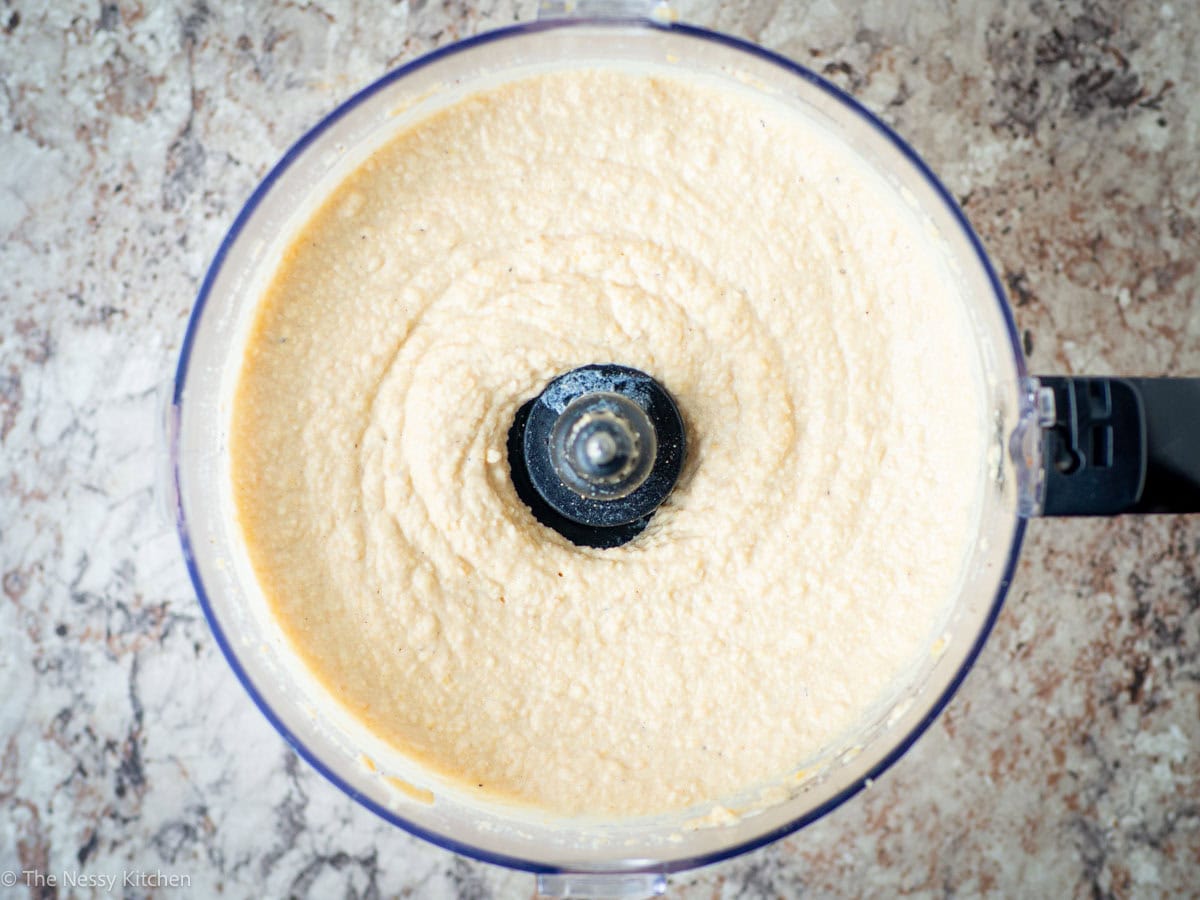 Smooth hummus in a processor.