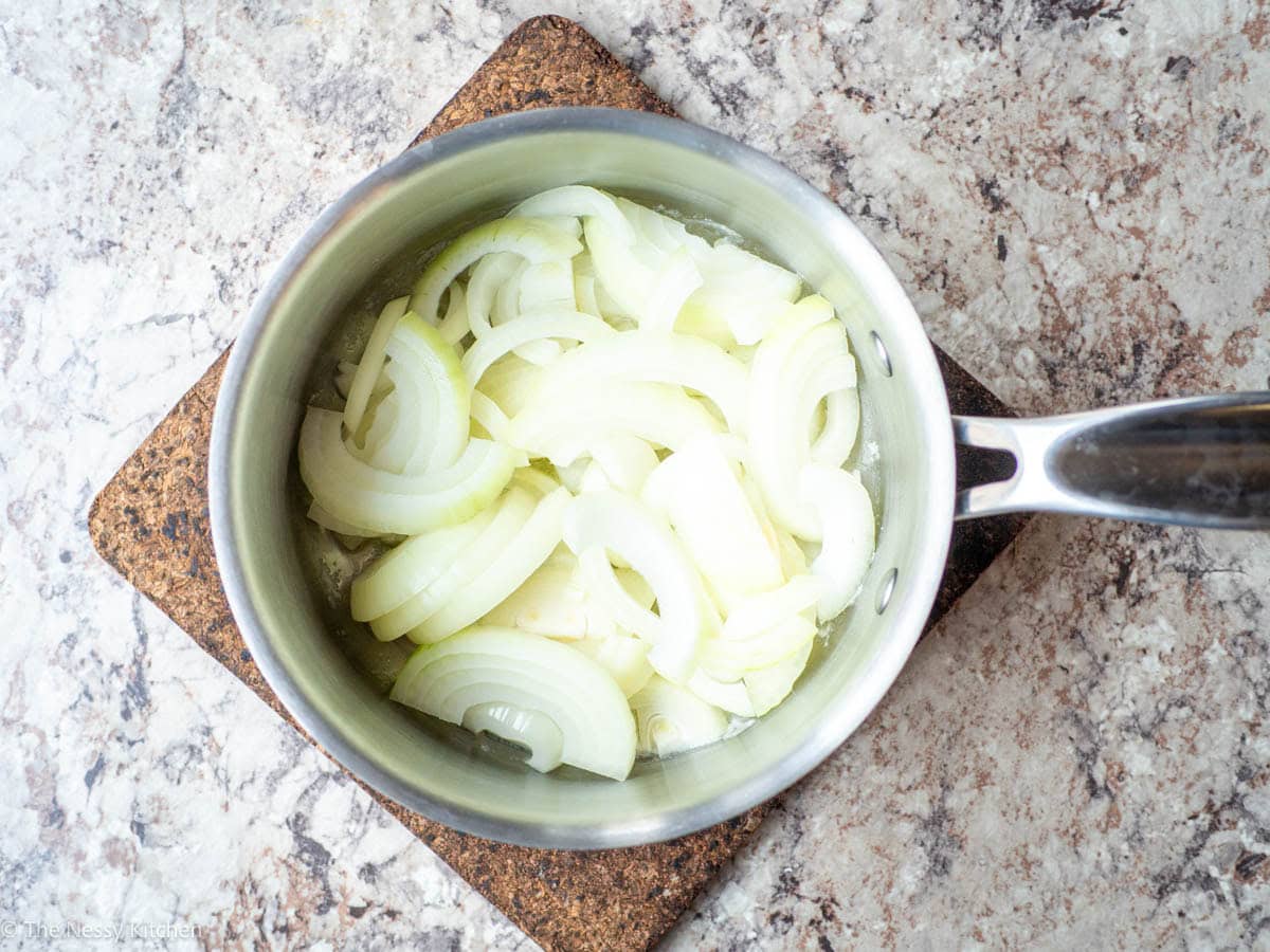 Onions added to the saucepan with butter.