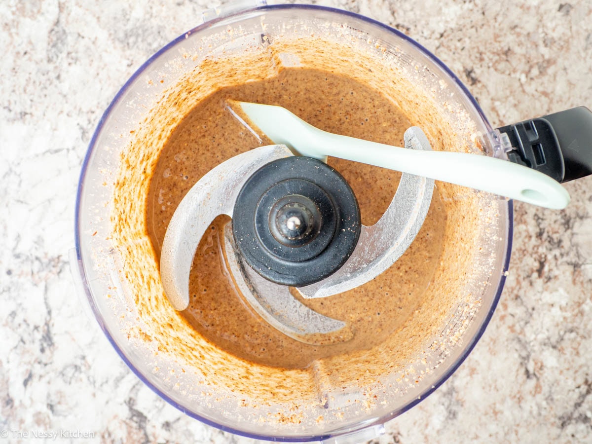Pecan butter in the base of food processor.