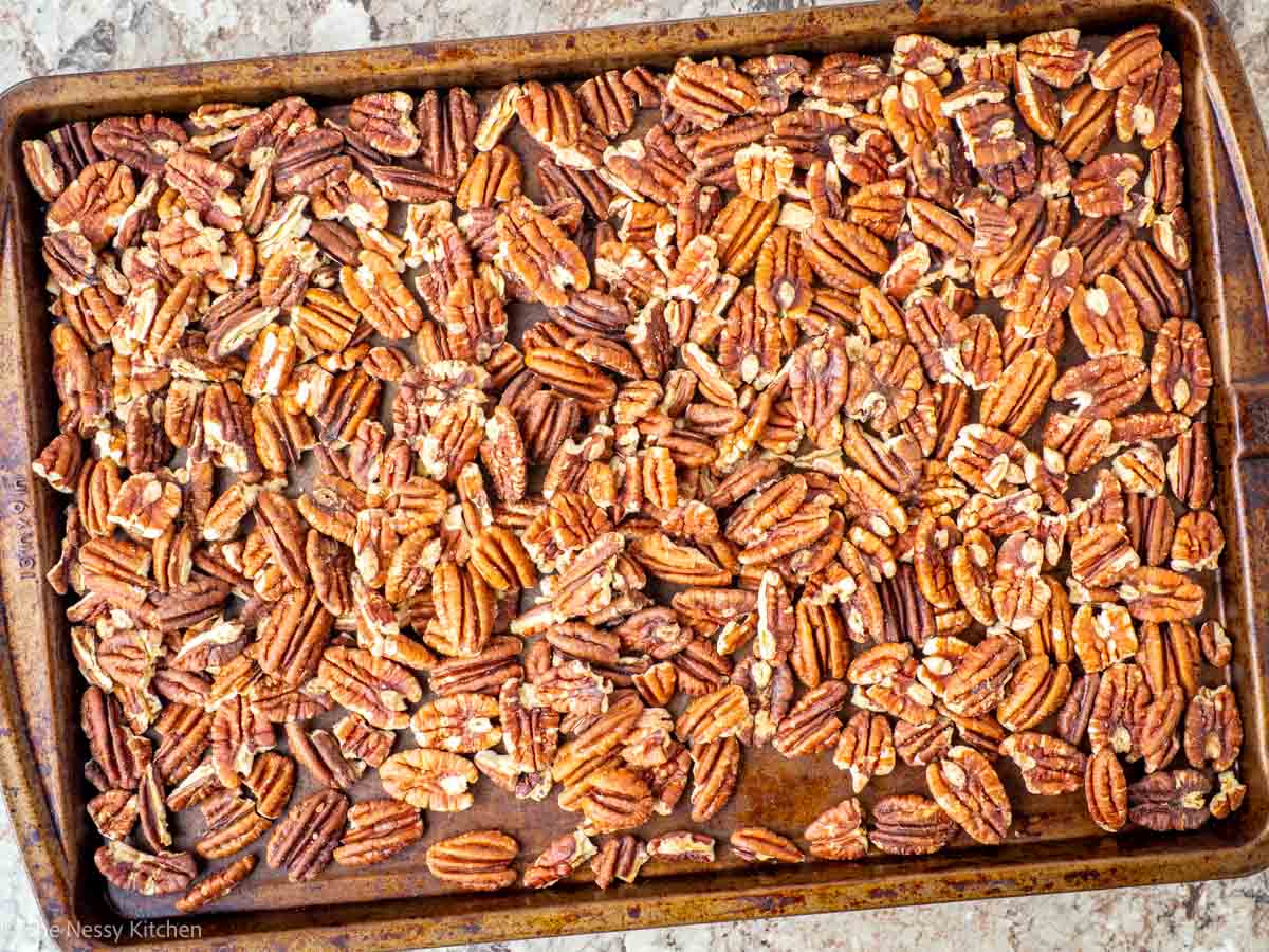 Pecans roasted on a sheet pan.