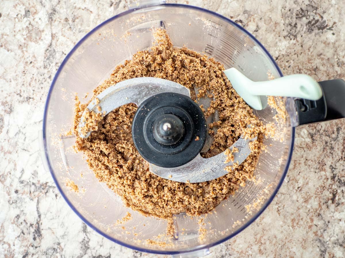 Pecan crumbs in a food processor as it is on its way to becoming butter.