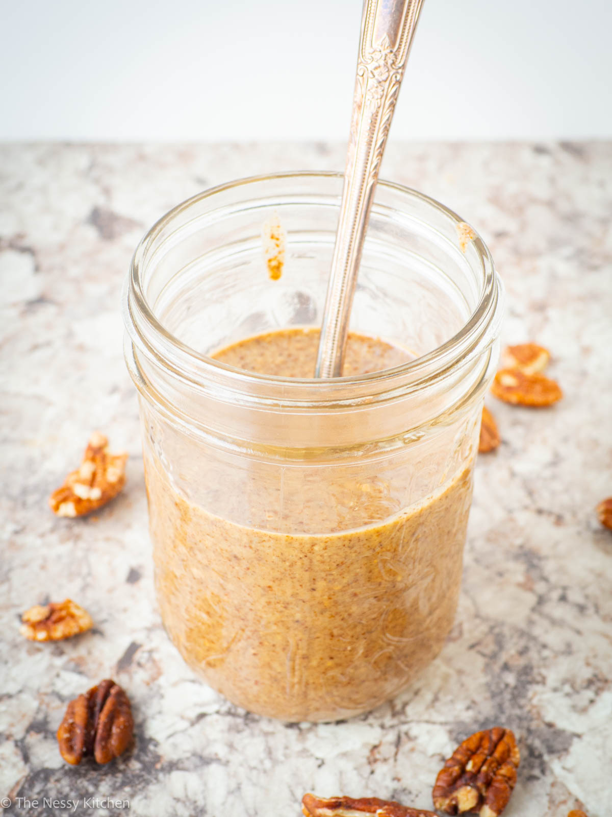 Spoon in a jar of nut butter.