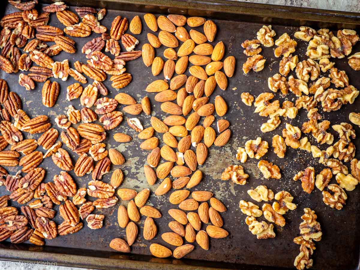 Nuts spread out onto a baking sheet.