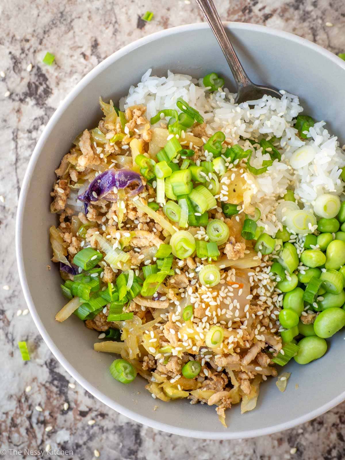 Egg roll bowl in a dish with a spoon.