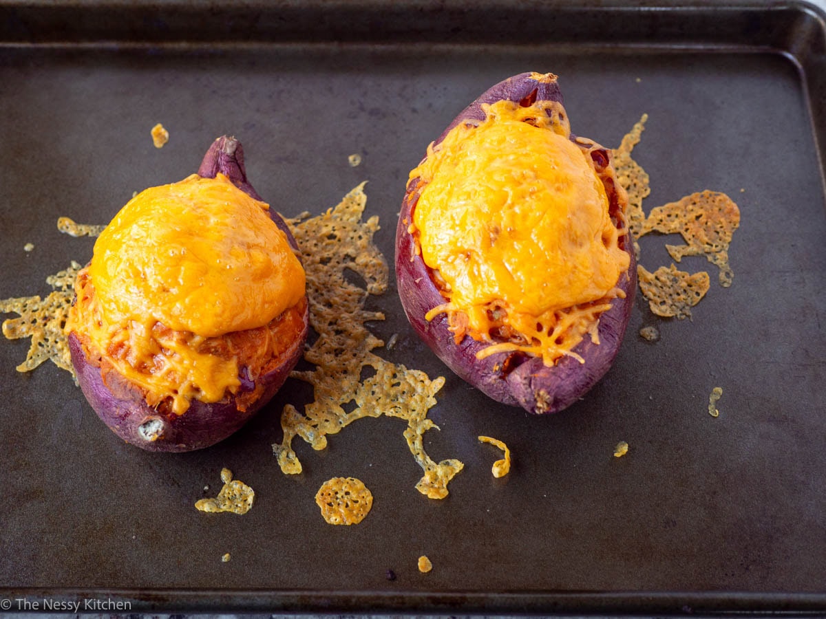 Stuffed sweet potatoes baked on a pan.