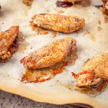 Chicken wings on a baking sheet.