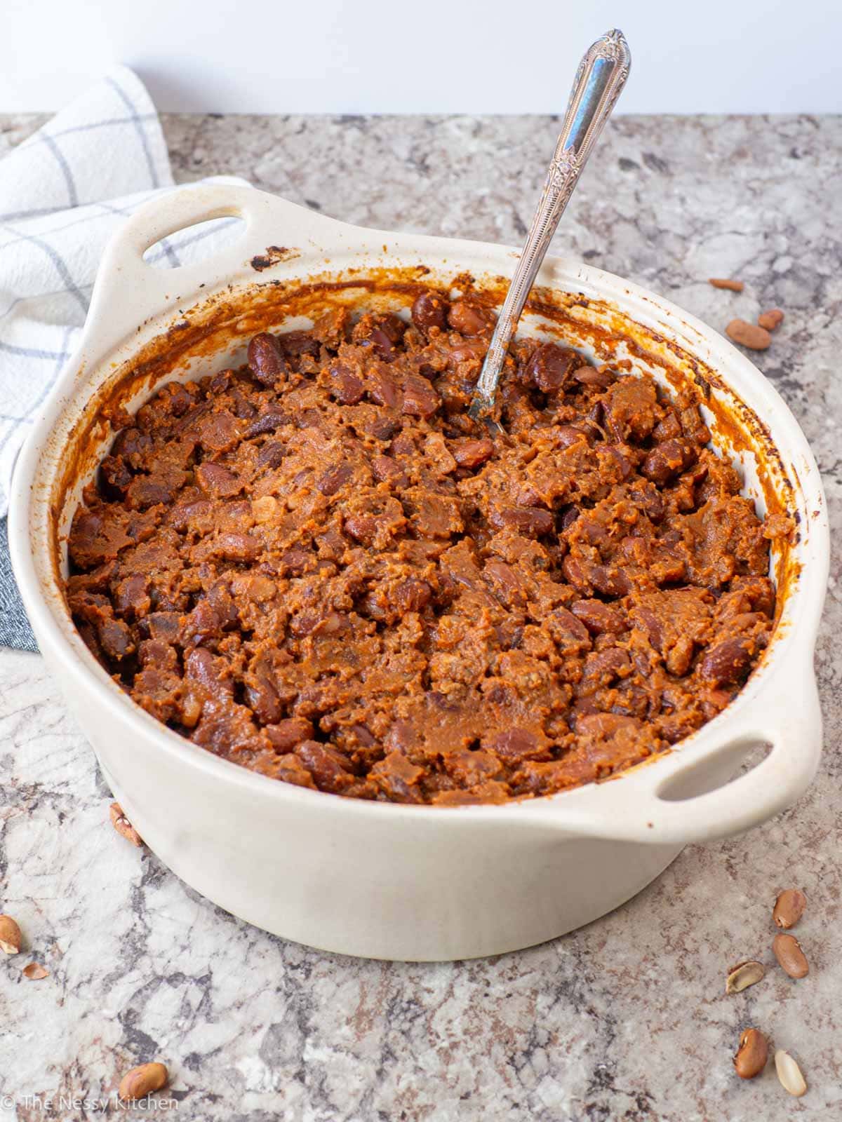 Casserole dish filled with baked beans.