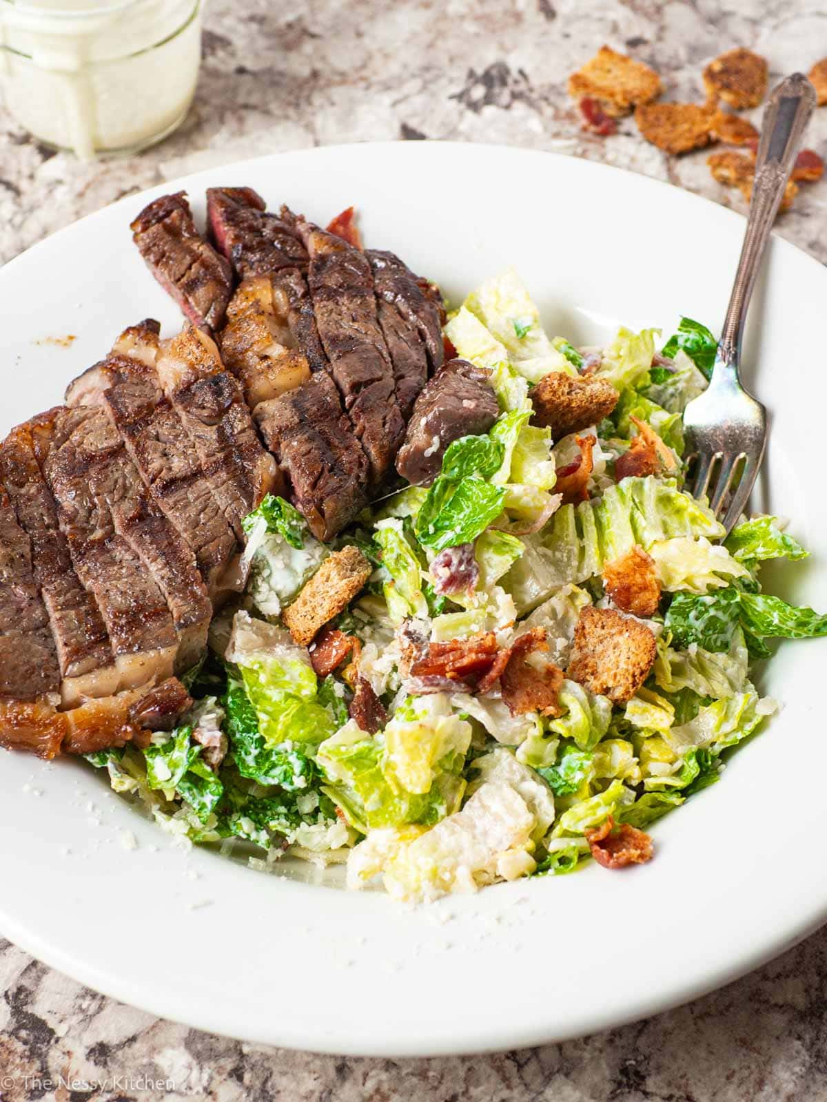 Bowl of Steak Caesar Salad.