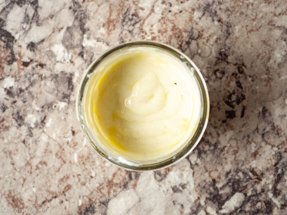 Dressing stirred together in a bowl.