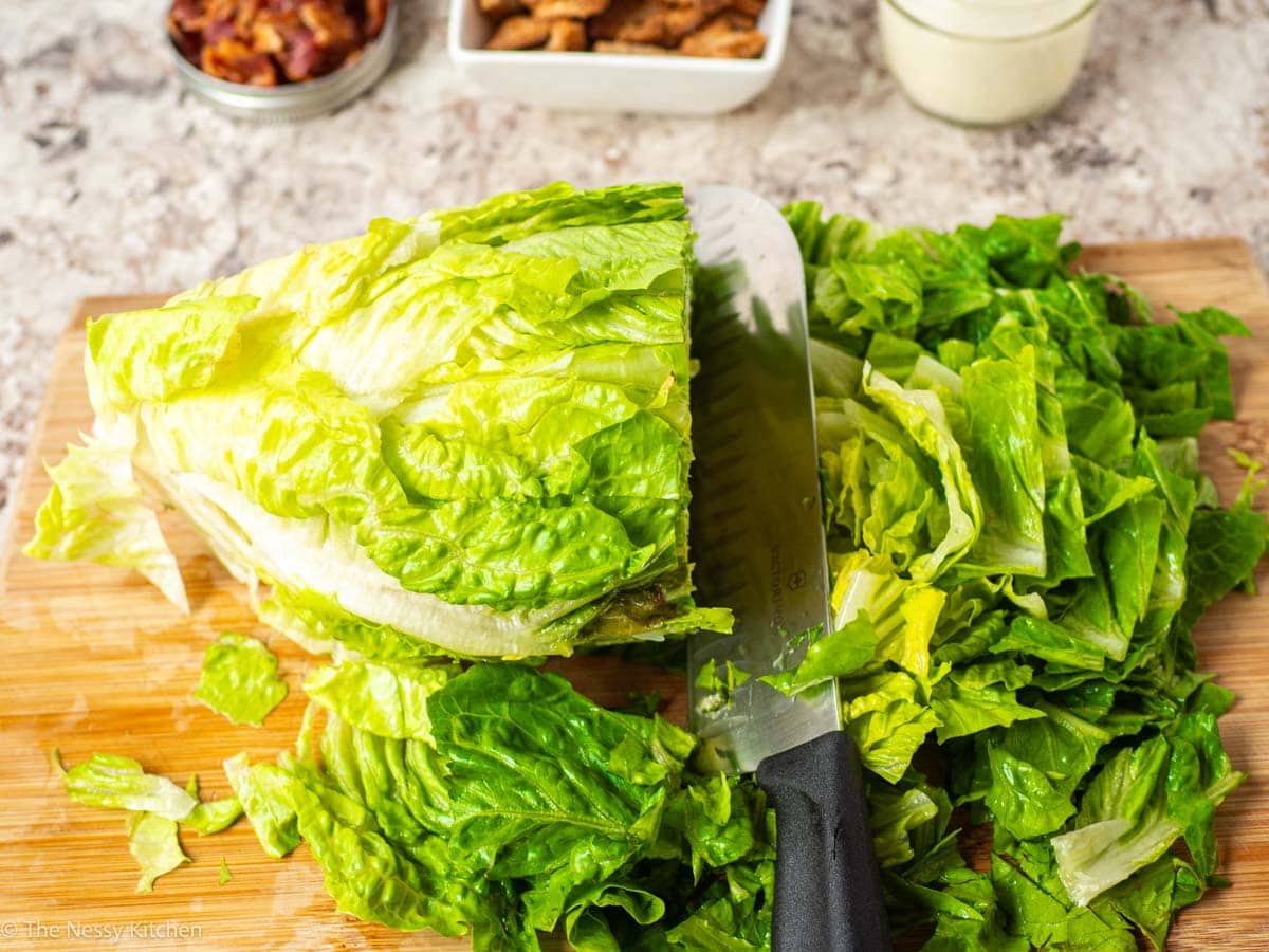 Lettuce sliced on a cutting board.