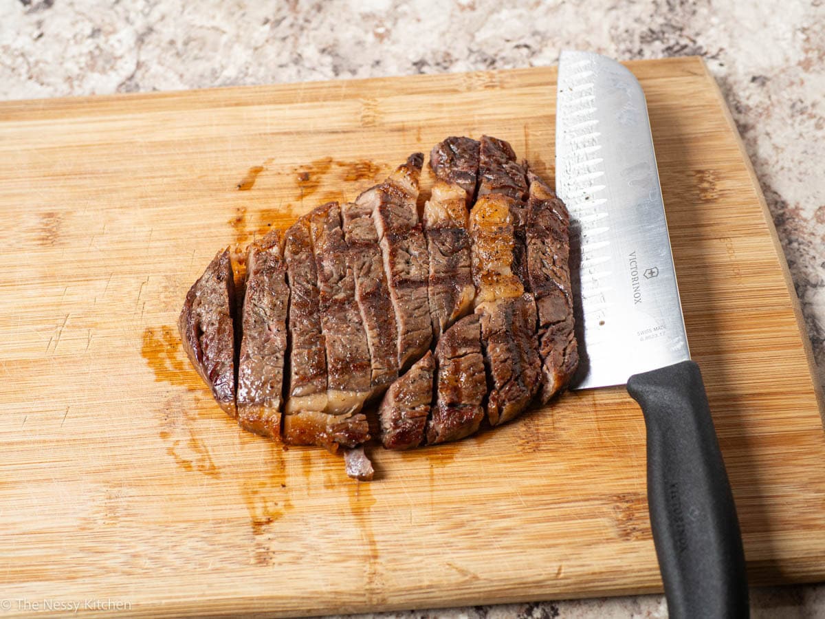 Steak sliced on a cutting board.
